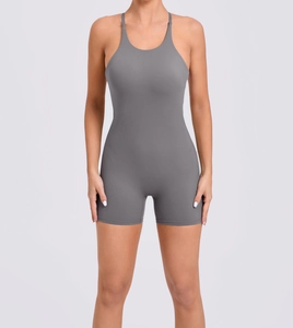Detailed close-up of dark grey high-elastic yoga jumpsuit with halter neck and tight fit