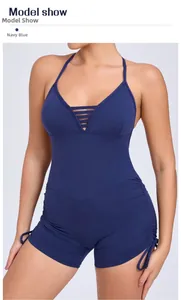 Detail view of navy blue yoga jumpsuit featuring hollow-out chest and side drawstring