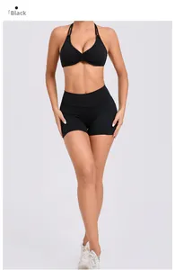 Detail of black halter sports bra and high-waisted shorts set for yoga and fitness