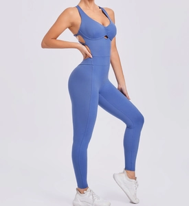 Detail view of the side cutout and high-elastic fabric of the grey-blue yoga bodysuit