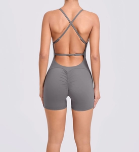Detail of cross-back straps and scrunch butt design on dark gray yoga onesie