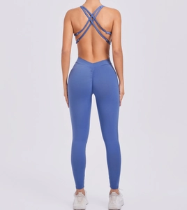 Close-up of fog blue yoga jumpsuit showing cross-back straps and scrunch butt detail