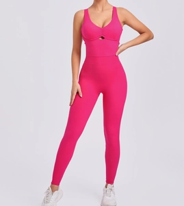 Detailed close-up of pink yoga jumpsuit featuring a stylish V-neck and chest cutout design