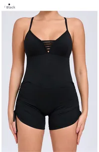 Close-up of black yoga jumpsuit with side drawstring detail and racerback design