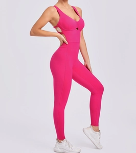 Detail of fuchsia yoga bodysuit featuring back cut-outs and adjustable buckles