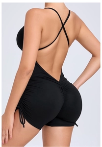 Close-up of ruched back detail and adjustable side drawstrings on black yoga jumpsuit
