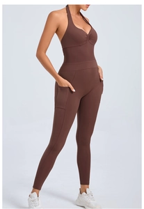 Detail of coffee brown halter yoga jumpsuit featuring side pockets and backless design