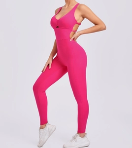 Detail of rose red yoga jumpsuit showing the open back and adjustable side buckle