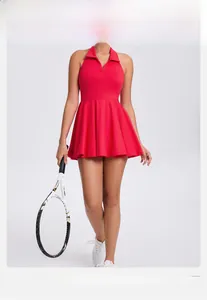 Detailed view of red halter neck sports dress with pleated hem and elastic athletic fabric