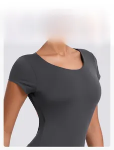Detail of grey athletic bodysuit featuring a classic round neck and stretch fabric