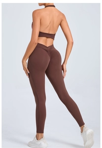 Rear view of brown scrunch butt yoga jumpsuit showing backless halter neck design