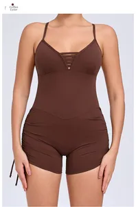 Detail of coffee brown yoga jumpsuit with side drawstrings and deep V-neckline straps