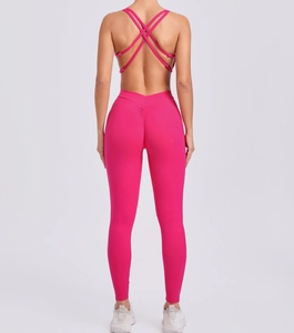 Detail of rose red yoga jumpsuit showing criss-cross back straps and v-waist scrunch butt