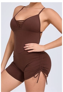 Detail of a brown backless yoga bodysuit with side drawstrings and thin straps