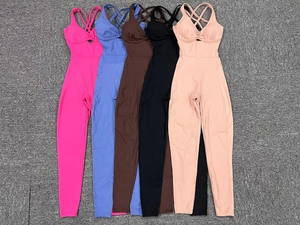 Detailed flat lay of yoga jumpsuits showing cross-back straps and hollow chest design