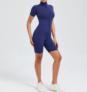 Detail of slim-fit navy blue yoga bodysuit featuring a front zipper and high-stretch fabric