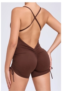 Detailed back view of brown ruched yoga jumpsuit with criss-cross back straps design
