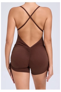 Detail of cross-back straps and scrunch butt design on chocolate brown yoga jumpsuit