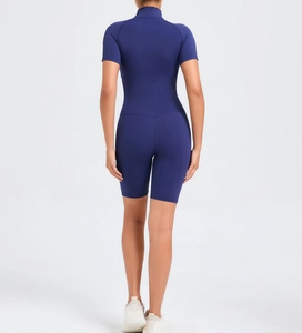 Close-up of slim fit navy blue short sleeve yoga bodysuit with back sculpting design