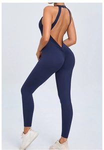 Detail of deep blue open back yoga jumpsuit with scrunch butt lifting design for fitness