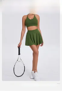 Detail of olive green high-stretch pleated tennis skirt and halter neck sports bra outfit