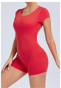 Close-up of red open-back yoga bodysuit with seamless stitching and high-stretch fabric