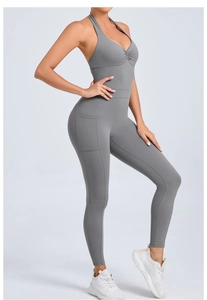 Detail view of the halter neck yoga bodysuit with side pockets in charcoal grey fabric