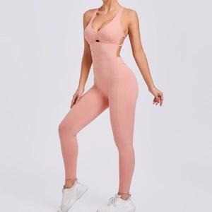 Peach pink yoga jumpsuit with cut-out waist and adjustable back straps for gym fitness