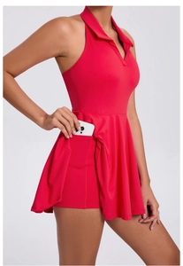 Detail view of the red tennis dress showing the built-in shorts and functional side pocket
