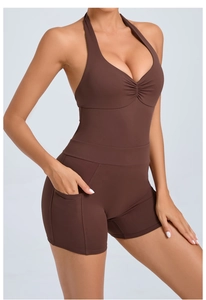 Detail of dark brown backless yoga bodysuit featuring halter neck and side pockets