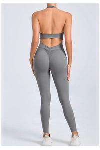 Detail view of the backless halter yoga bodysuit with ruched booty design in grey