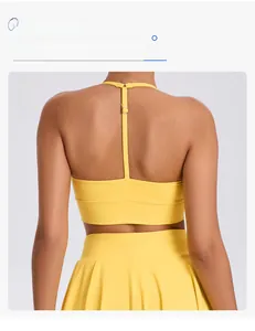 Detail of bright yellow sports bra featuring adjustable straps and square open back design