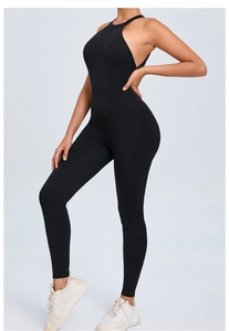 Detail of a black backless yoga jumpsuit with halter neck and slim fit athletic design