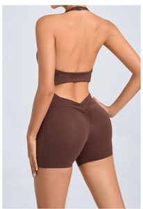 Rear view of brown backless yoga bodysuit with scrunch design and side pockets for fitness