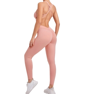 Pink backless yoga jumpsuit with cross straps and scrunch butt lifting for fitness
