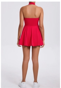 Back view of a red racerback tennis dress with a pleated A-line skirt for outdoor sports