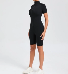 Side view of black athletic bodysuit with high-stretch fabric and front zipper detail