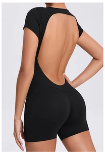 Detailed back view of a black open-back yoga bodysuit with high-stretch ribbed fabric