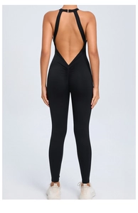 Macro detail of black ruched back and open back design on a fitness yoga bodysuit