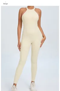Front view of beige backless one-piece yoga jumpsuit with neck strap and slimming seams