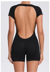 Detail view of backless yoga jumpsuit featuring a deep U-shaped cutout and slim fit design