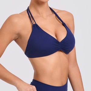 Top sportivo yoga blu navy allacciato al collo con doppie spalline e dettagli arricciati