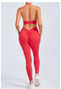 Detail of red backless yoga jumpsuit featuring scrunch butt design and side pockets