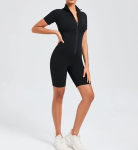 Close-up of black short sleeve yoga bodysuit with zipper front and stand-up collar