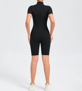 Back view of black short sleeve yoga jumpsuit with sleek compression fit and athletic design