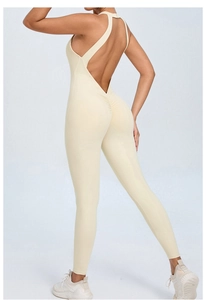 Detail of light beige yoga bodysuit showing deep V backless cut and scrunch butt design