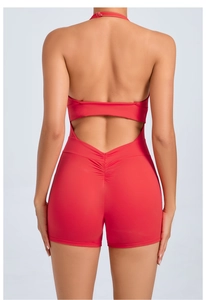 Detail of red backless yoga jumpsuit with halter neck adjustment and scrunch butt design