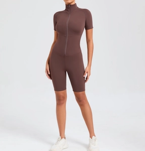 Detail view of the sleek zip-up neckline and short sleeves on dark coffee yoga bodysuit