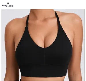 Close-up of black deep V-neck sports bra with adjustable straps and textured fabric