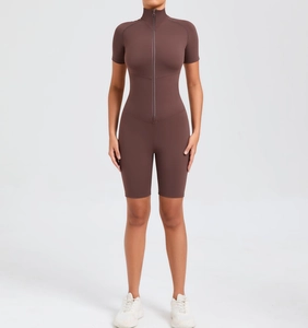Detail of a dark brown short-sleeved yoga bodysuit featuring a front zipper and slim fit waist